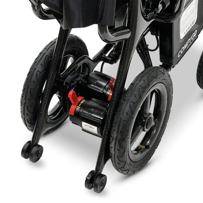 Close-up of the ComfyGO Phoenix Carbon electric wheelchair dual motor drive system with rear wheels, anti-tip wheels, and lightweight carbon fiber folding frame.