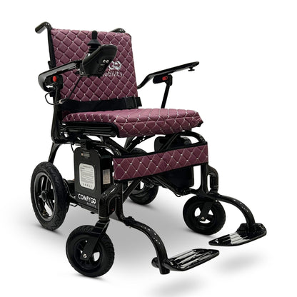 Front angled view of the purple ComfyGO Phoenix Carbon electric wheelchair featuring a lightweight carbon fiber frame, quilted seat cushions, joystick controller, foldable design, and compact travel-ready mobility system.