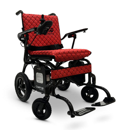 Front angled view of the red ComfyGO Phoenix Carbon electric wheelchair with lightweight carbon fiber frame, quilted seating, joystick controller, foldable travel design, and compact powered mobility system.