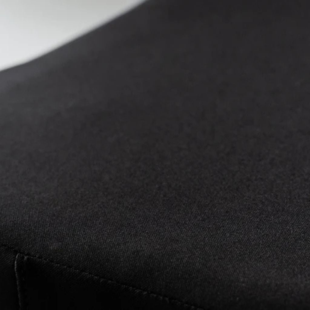 Close-up of the Ease Cushion cover's smooth waterproof fabric and stitched seam"