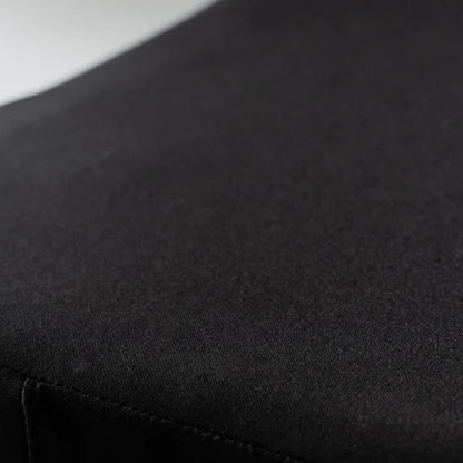 Close-up of the Ease Cushion cover's smooth waterproof fabric and stitched seam"