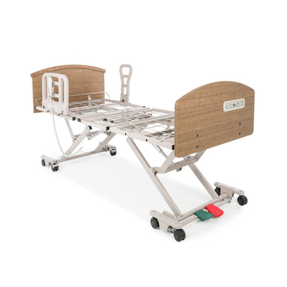 Graham-Field Zenith 7200 hi-lo bed raised flat, viewed from the foot end showing the central two-pedal locking system