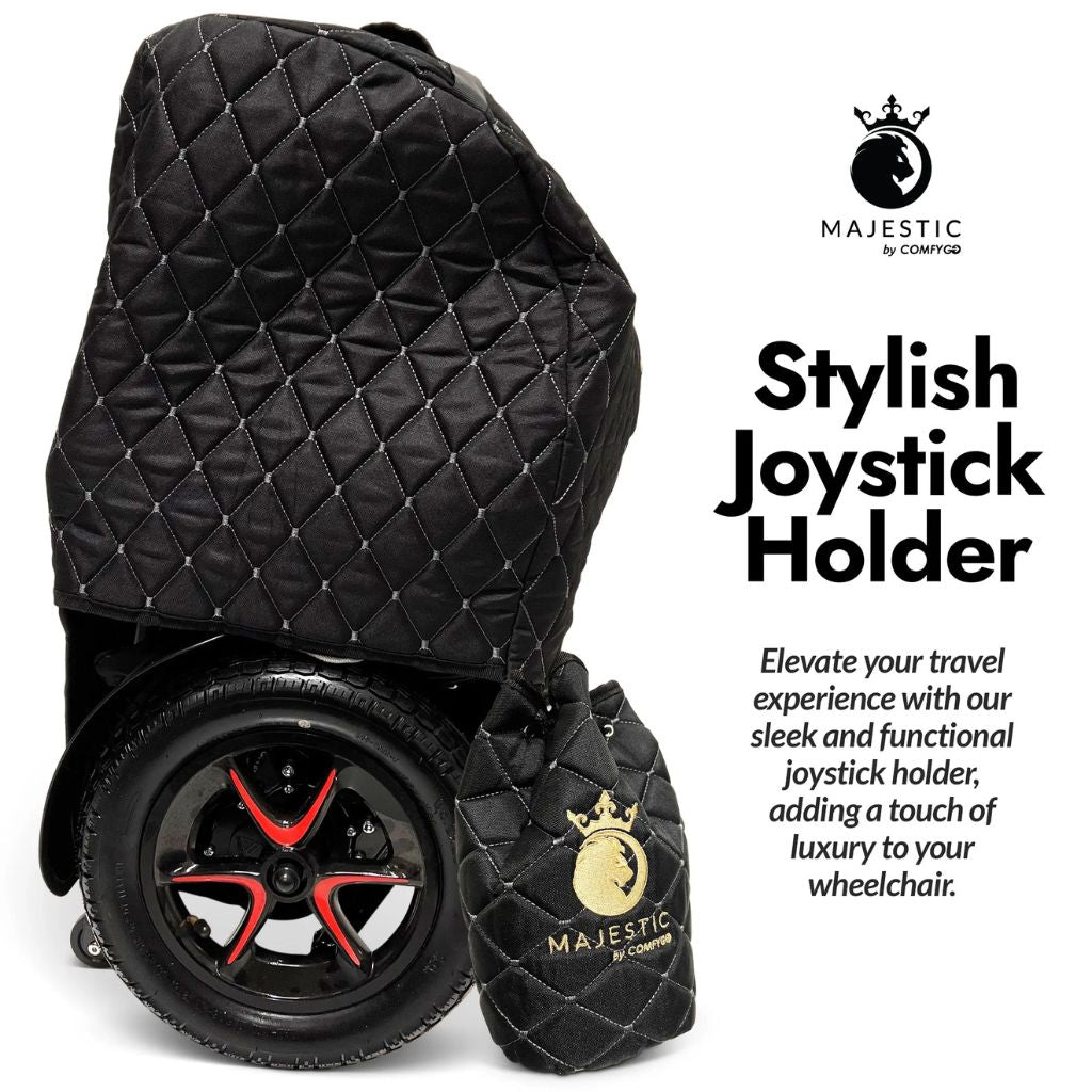 Majestic quilted joystick holder bag hanging beside a covered folded wheelchair, with gold embroidered logo