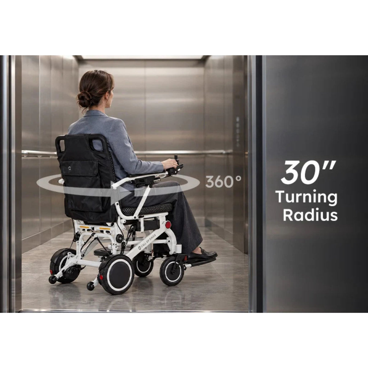 Woman turning the OAS Air Pro 2027 electric wheelchair inside an elevator, showing its 30-inch turning radius