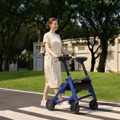 Woman walking with the Paiseec FLEX R3 in Blue as a power-assist rollator across a crosswalk