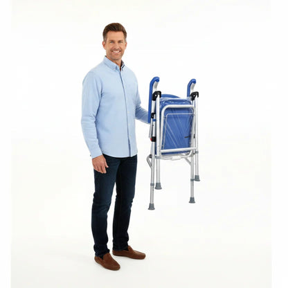 Man carrying the folded UltraCommode padded commode chair with one hand, showing its lightweight portable design